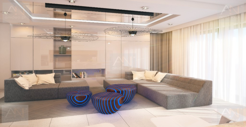 Salon penthouse’u z rzeźbiarskimi pufami, niskim stołem i miękkim światłem.